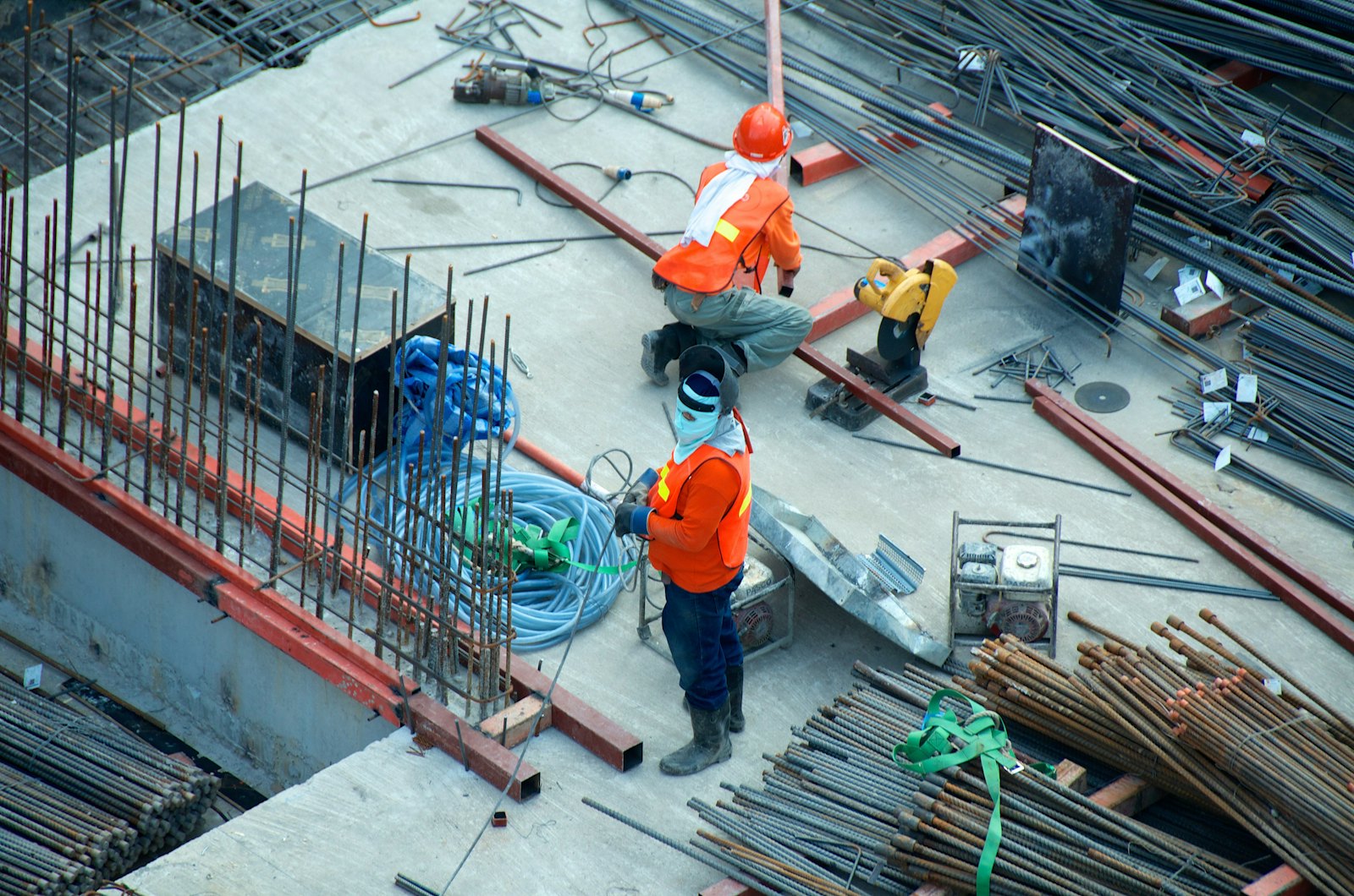 Construction workers preparing work on a building site